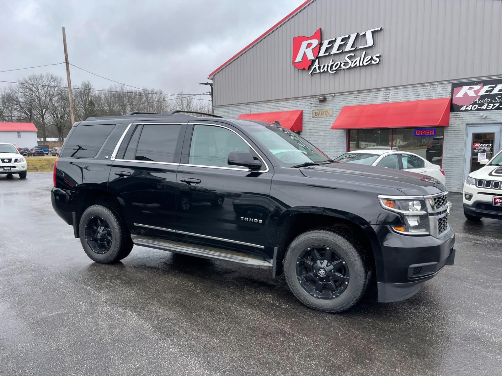 2015 Black /Black Chevrolet Tahoe LS 4WD (1GNSKAEC8FR) with an 5.3L V8 OHV 16V engine, 6-Speed Automatic transmission, located at 547 E. Main St., Orwell, OH, 44076, (440) 437-5893, 41.535435, -80.847855 - This 2015 Chevrolet Tahoe LS 4WD is a versatile and robust full-size SUV that offers a range of comfort and utility features, appealing to families and those needing a capable vehicle for towing and outdoor adventures. Equipped with Tri-Zone Automatic Climate Control, Power Front Seats, and Rain Sen - Photo #3